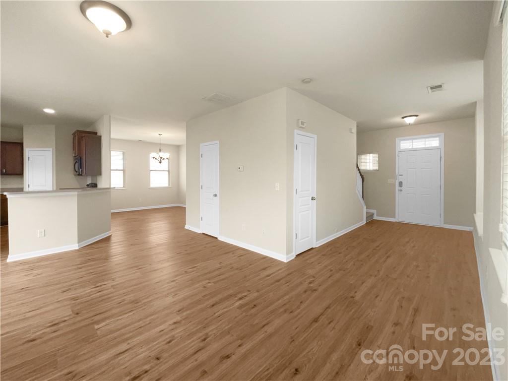 10775 Traders Court Davidson, NC 28036 - Photo 10 of 28 a view of empty room with wooden floor