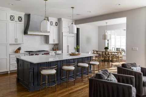 a kitchen with stainless steel appliances a sink stove and cabinets