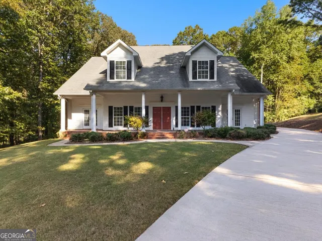 a front view of house with yard and green space