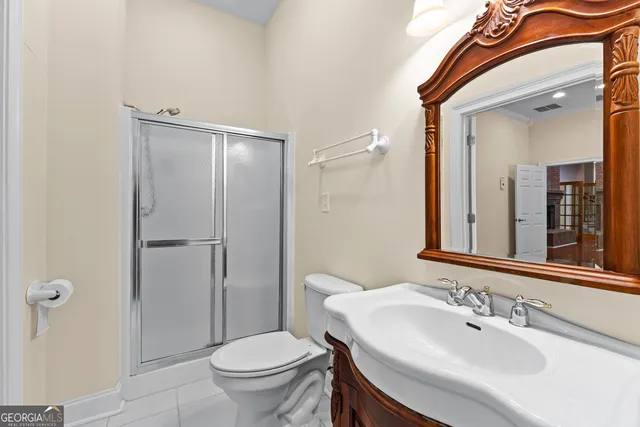 a view of a room with wooden floor and a large window