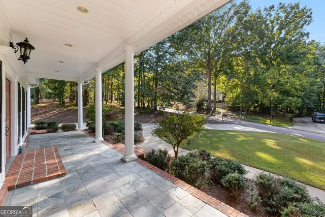 a view of an room with wooden floor and windows