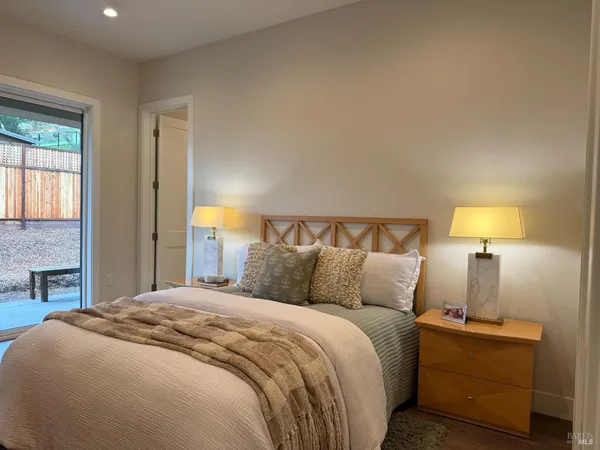 a kitchen with stainless steel appliances granite countertop a sink stove refrigerator and cabinets