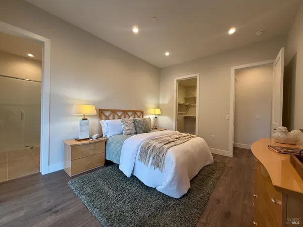 a bedroom with a bed and a lamp