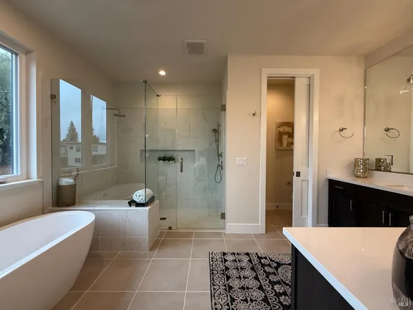 a bedroom with a bed and couch