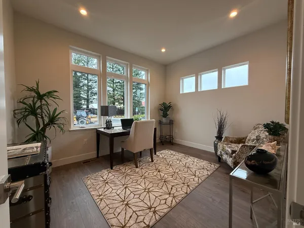 wooden floor in a hall with a window