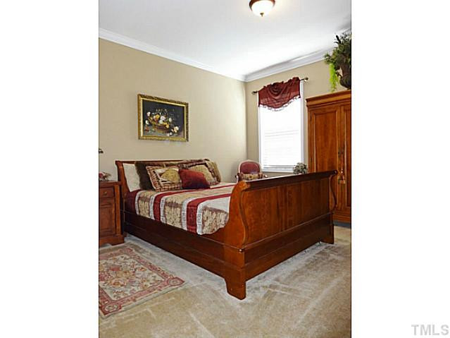 3212 Queensland Road Raleigh, NC 27614 - Photo 19 of 25 Bedroom 5. Located on the main living area, this bedroom can be used as an in-law suite. From this room, you can access a full bathroom. It features crown molding and has a large walk-in closet. Bedroom