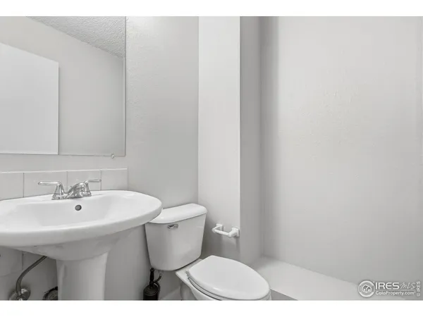 a bathroom with a sink toilet tub and shower