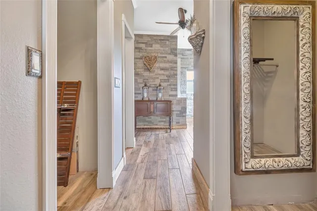 a view of empty room with windows and wardrobe