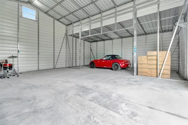 a view of a big yard with a large trees