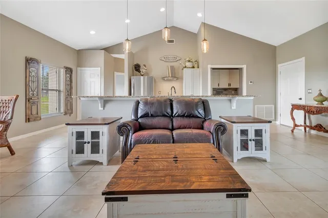 a living room with furniture and a table