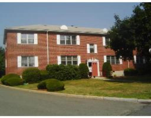 162 Lake Shore Road, Unit 4 Boston, MA 02135 - Photo 1 of 1 a front view of a residential apartment building with yard and green space