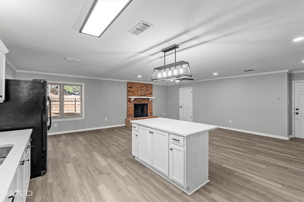 6016 Fox Ridge Shreveport, LA 71129 - Photo 25 of 33 wooden floor in an empty room with a window