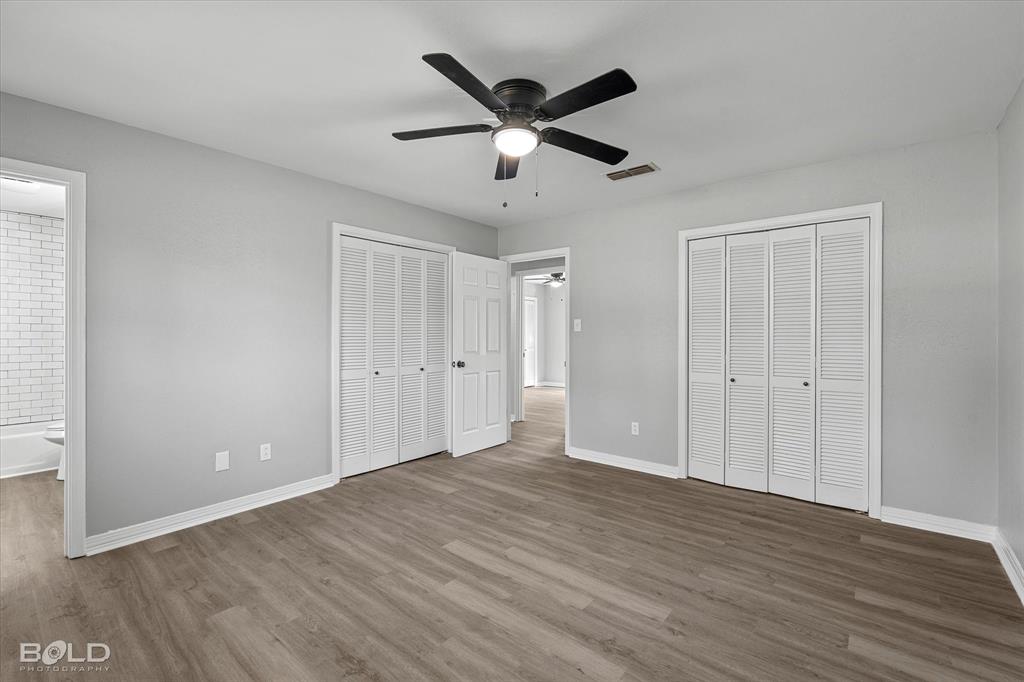 6016 Fox Ridge Shreveport, LA 71129 - Photo 27 of 33 a view of empty room with wooden floor and ceiling fan