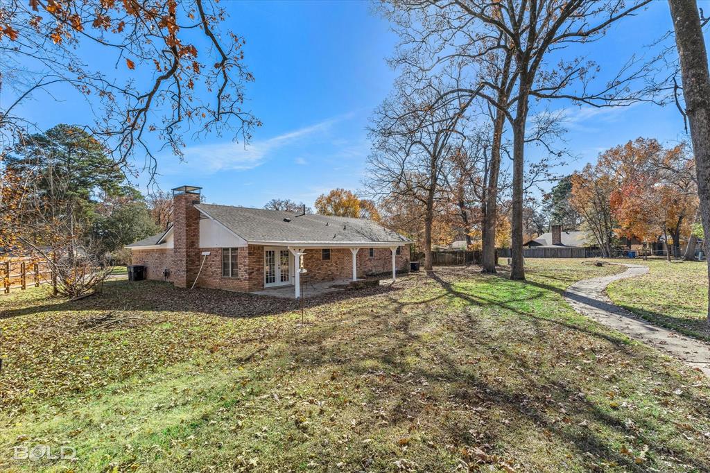 6016 Fox Ridge Shreveport, LA 71129 - Photo 8 of 33 a view of a house with a yard