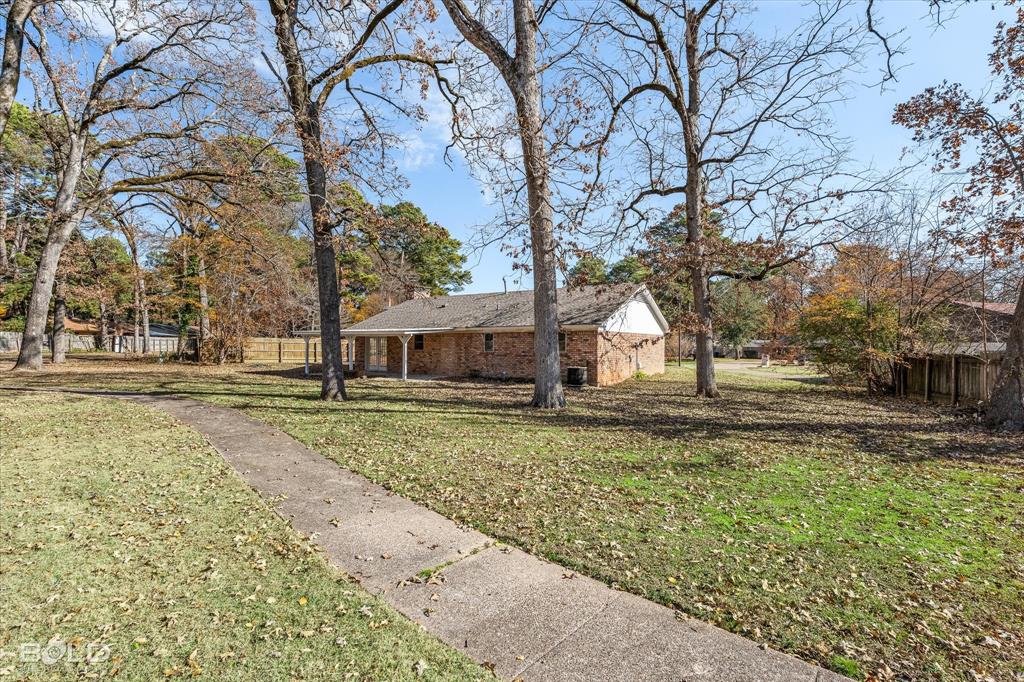 6016 Fox Ridge Shreveport, LA 71129 - Photo 10 of 33 a view of a yard with plants and trees