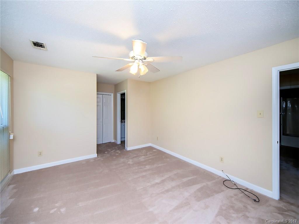740 Rama Road Charlotte, NC 28211 - Photo 12 of 15 an empty room with a ceiling fan and a window
