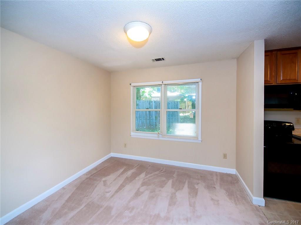 740 Rama Road Charlotte, NC 28211 - Photo 5 of 15 an empty room with windows and closet