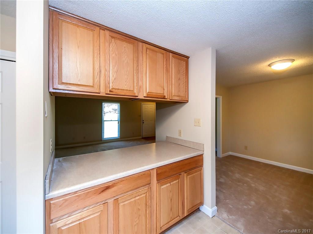 740 Rama Road Charlotte, NC 28211 - Photo 8 of 15 a kitchen with granite countertop cabinets and a sink