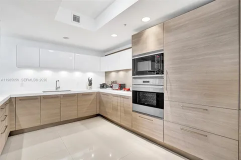 a kitchen with stainless steel appliances cabinets and a kitchen counter top