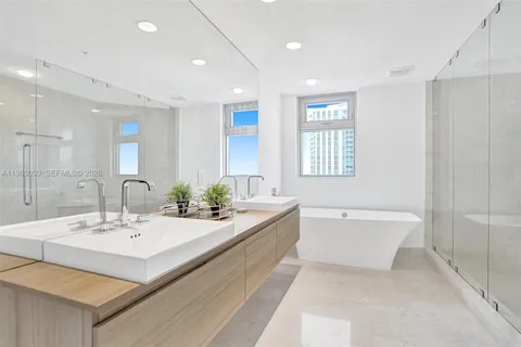 a bathroom with a bathtub and a sink