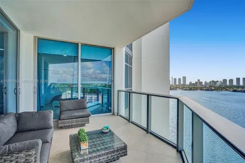 a balcony with furniture and city view