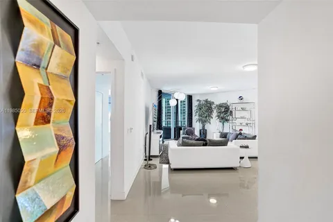 a living room with a couch and a large window