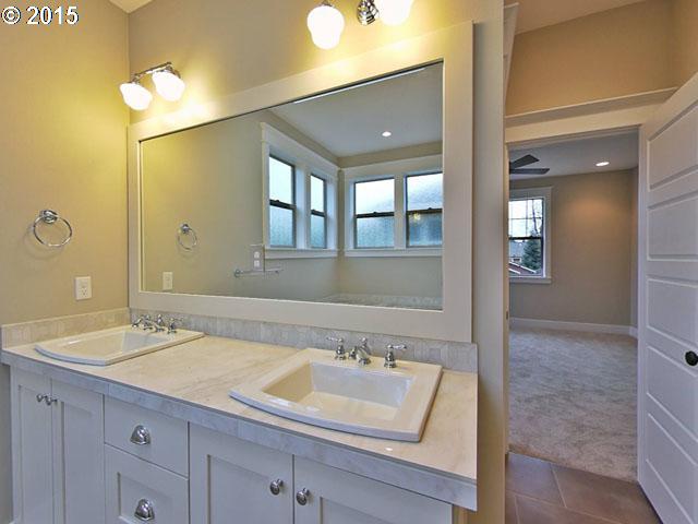 2437 North Alberta Street Portland, OR 97217 - Photo 16 of 16 a bathroom with a sink and a mirror