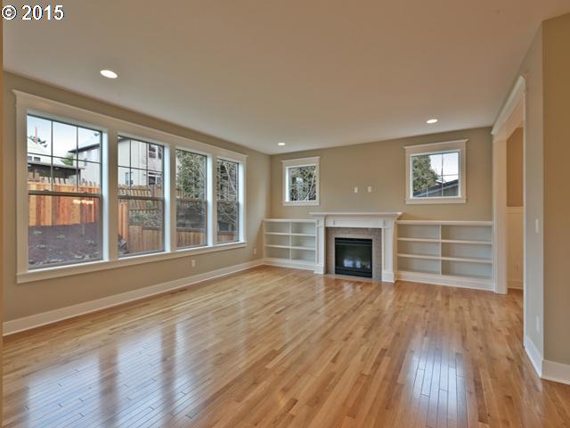 2437 North Alberta Street Portland, OR 97217 - Photo 3 of 16 a view of an empty room with wooden floor and a window