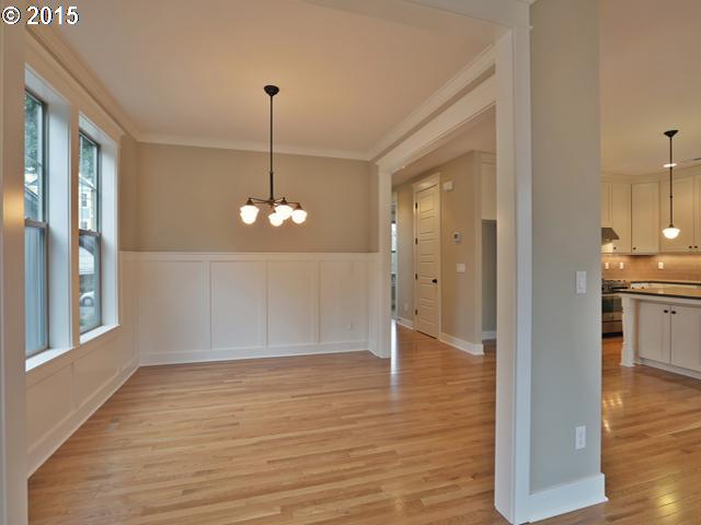 2437 North Alberta Street Portland, OR 97217 - Photo 4 of 16 a view of an empty room with wooden floor and a window