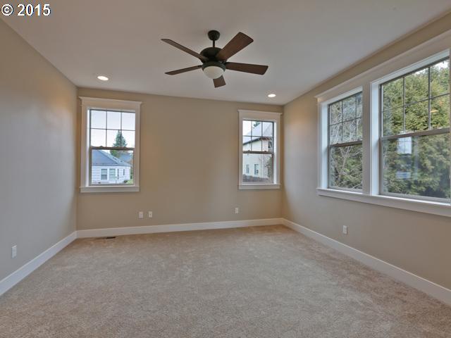2437 North Alberta Street Portland, OR 97217 - Photo 6 of 16 a view of room with a ceiling fan and window