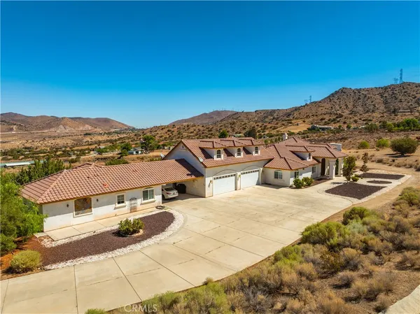 a view of a house with a mountain