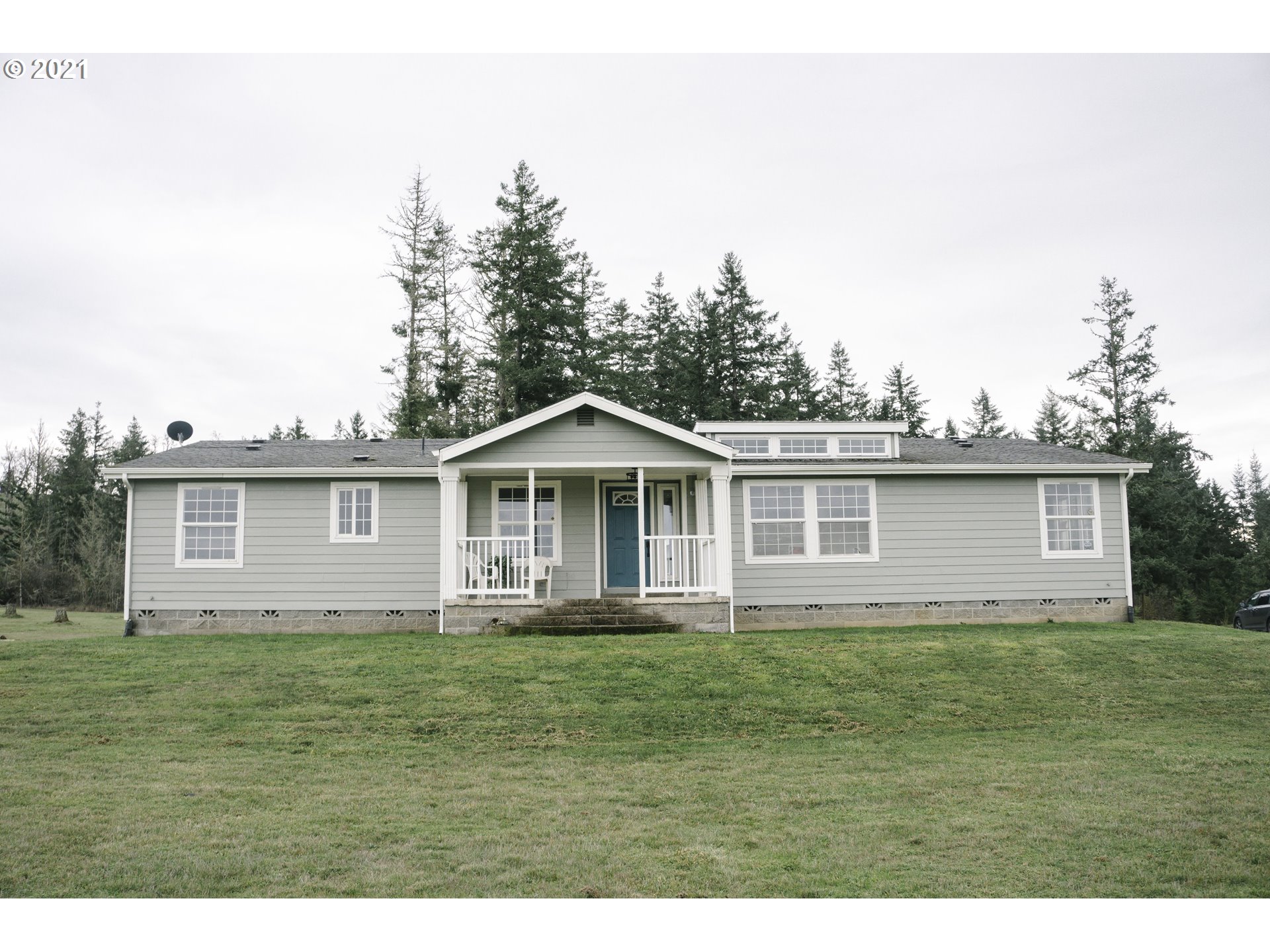 449 Fir Vista Road Sutherlin, OR 97479 - Photo 1 of 32 a front view of a house with a garden