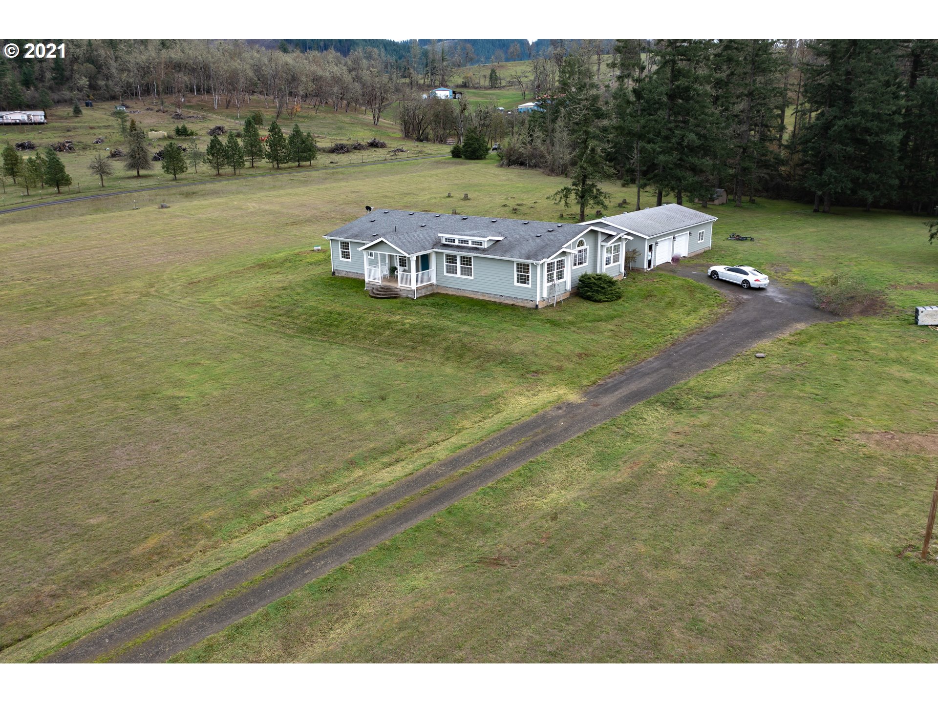 449 Fir Vista Road Sutherlin, OR 97479 - Photo 2 of 32 a view of a lake with a mountain