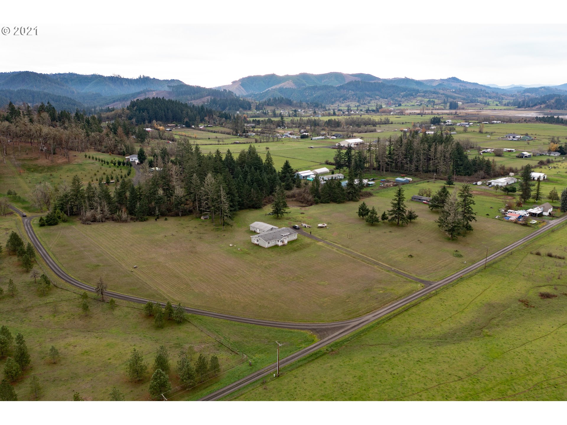 449 Fir Vista Road Sutherlin, OR 97479 - Photo 5 of 32 a view of a lake with a mountain