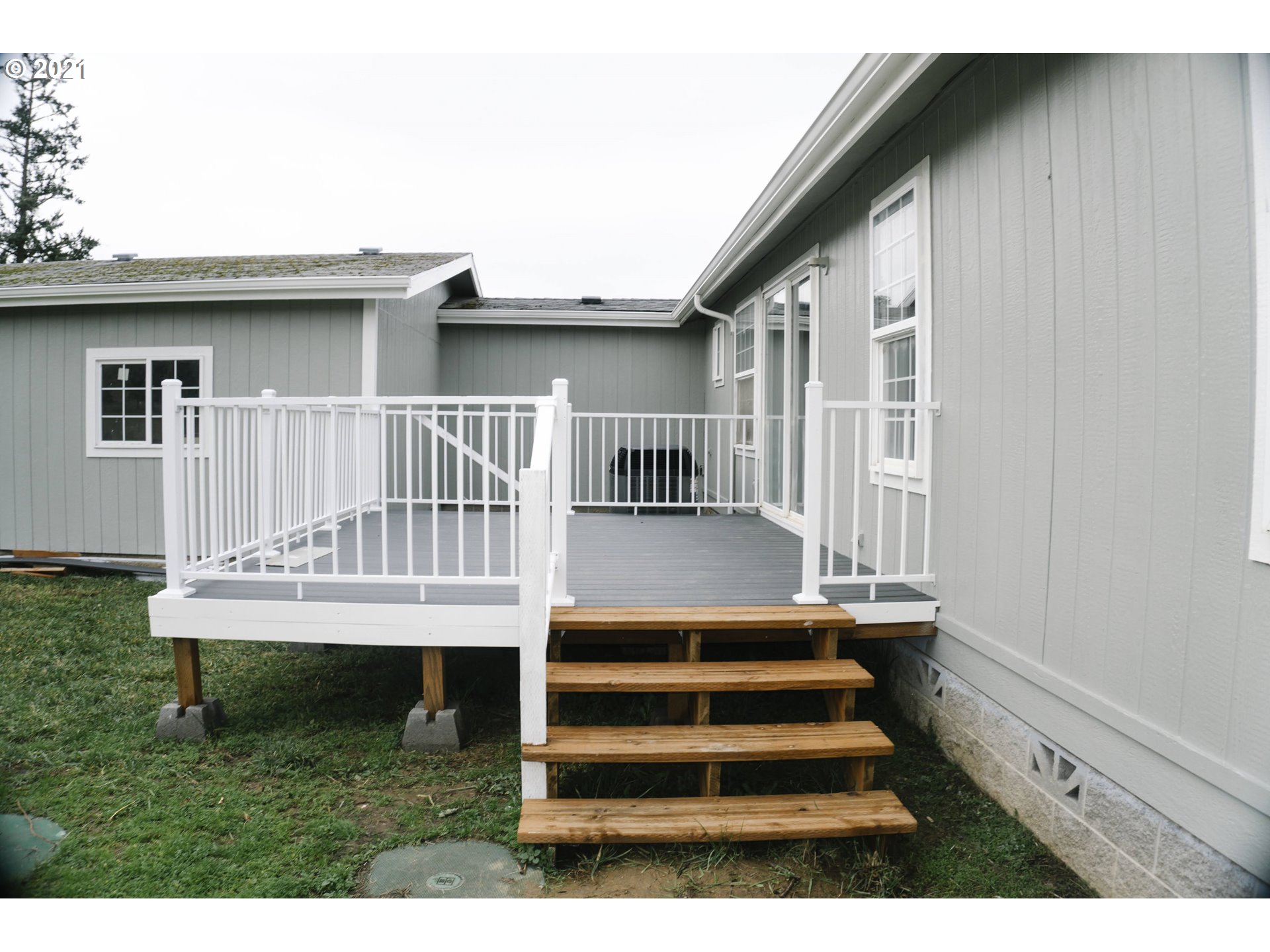 449 Fir Vista Road Sutherlin, OR 97479 - Photo 9 of 32 a view of a house with wooden deck and furniture