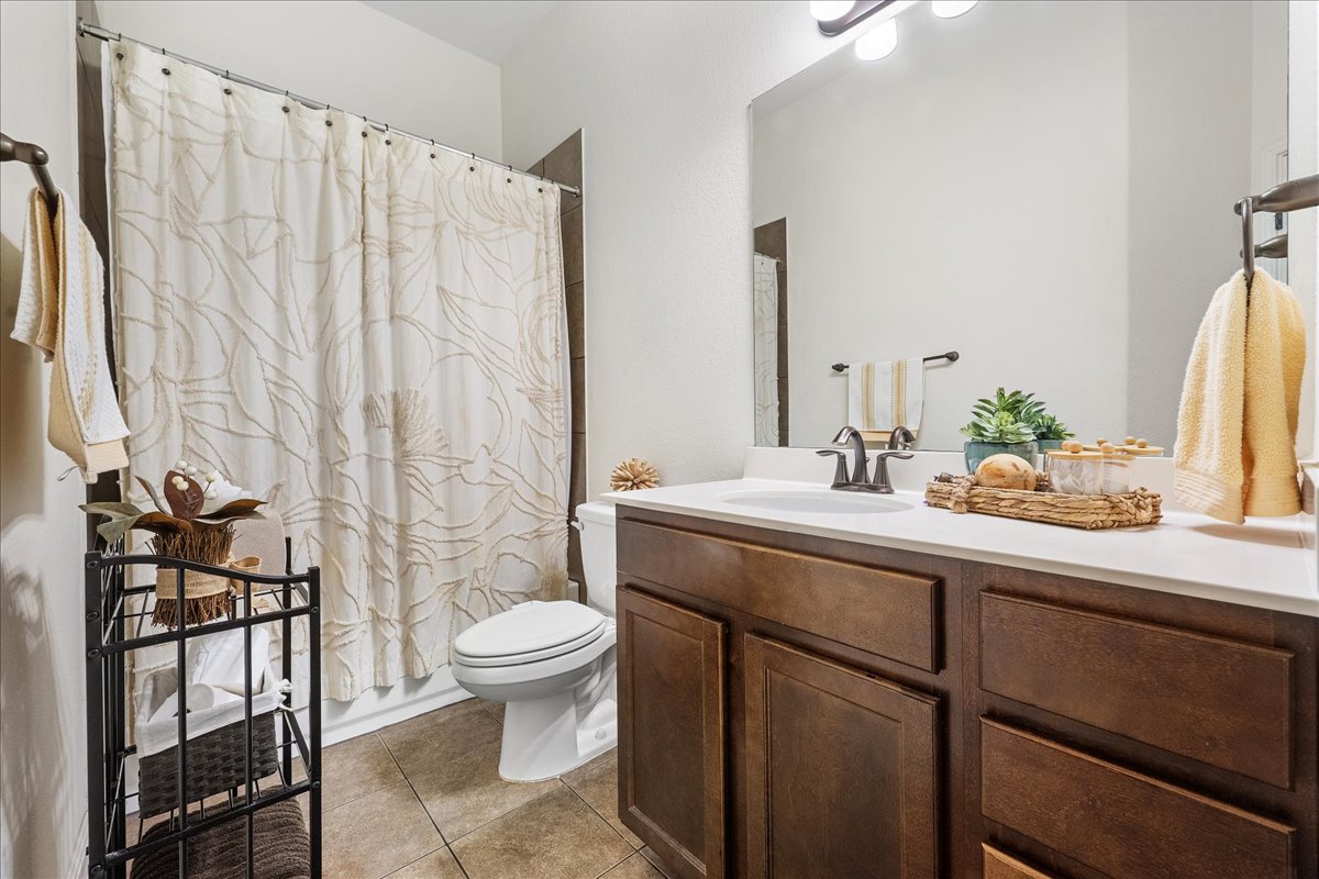 3000 Rio Verde Drive Leander, TX 78641 - Photo 16 of 23 a bathroom with a sink a toilet and a mirror