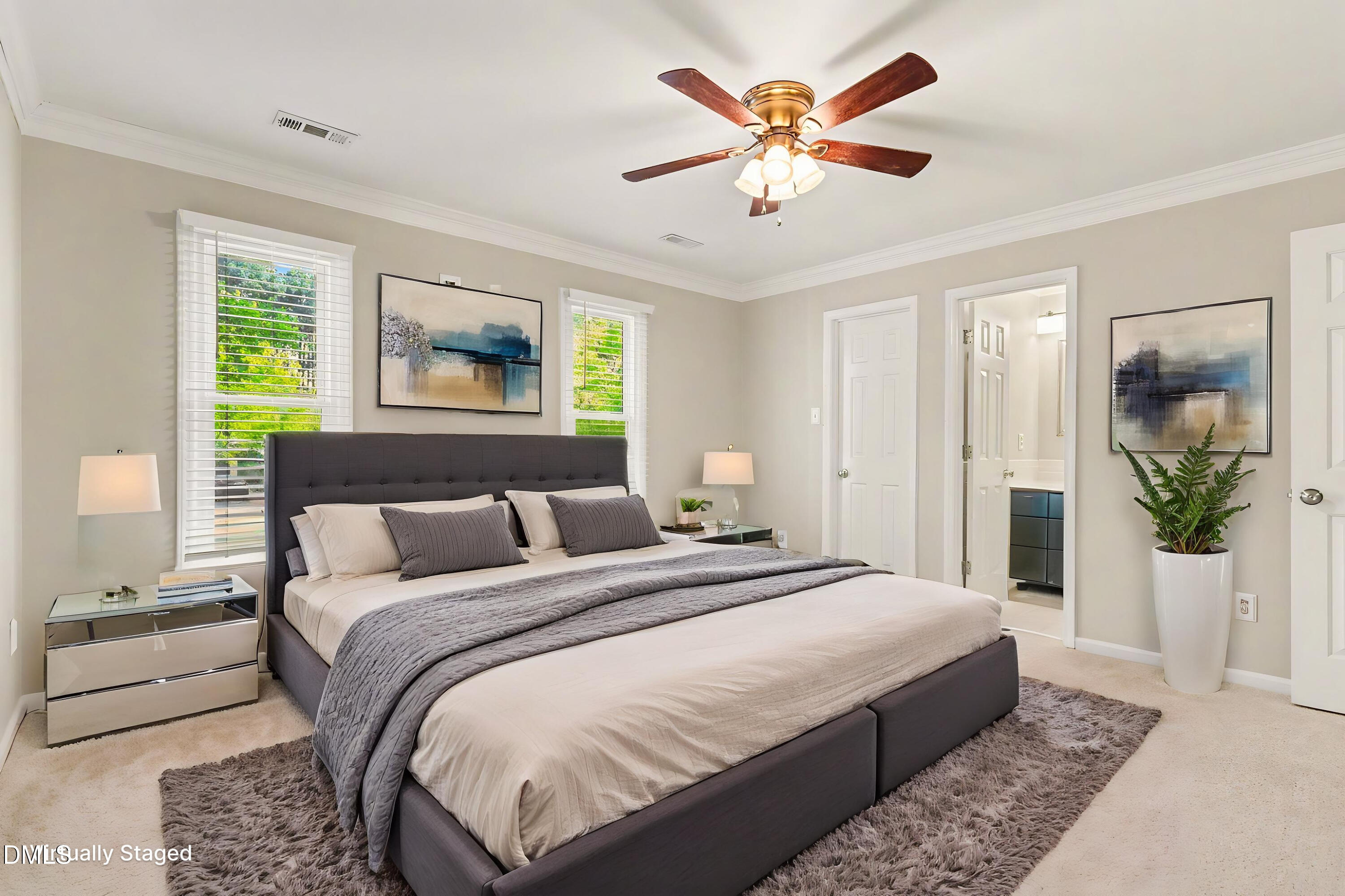5645 Hamstead Crossing Raleigh, NC 27612 - Photo 5 of 35 a bedroom with a large bed and a chandelier