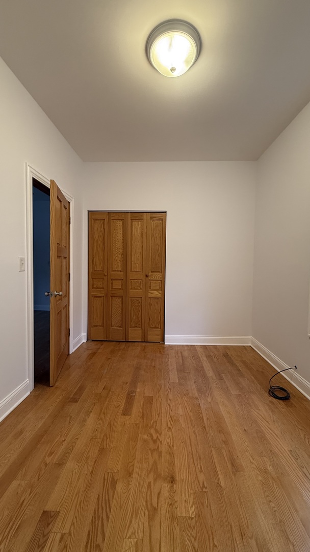 2216 North Central Avenue, Unit 1 Chicago, IL 60639 - Photo 13 of 28 an empty room with a empty space and windows