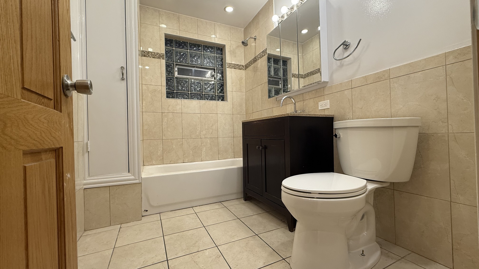 2216 North Central Avenue, Unit 1 Chicago, IL 60639 - Photo 15 of 28 a bathroom with a sink toilet and shower