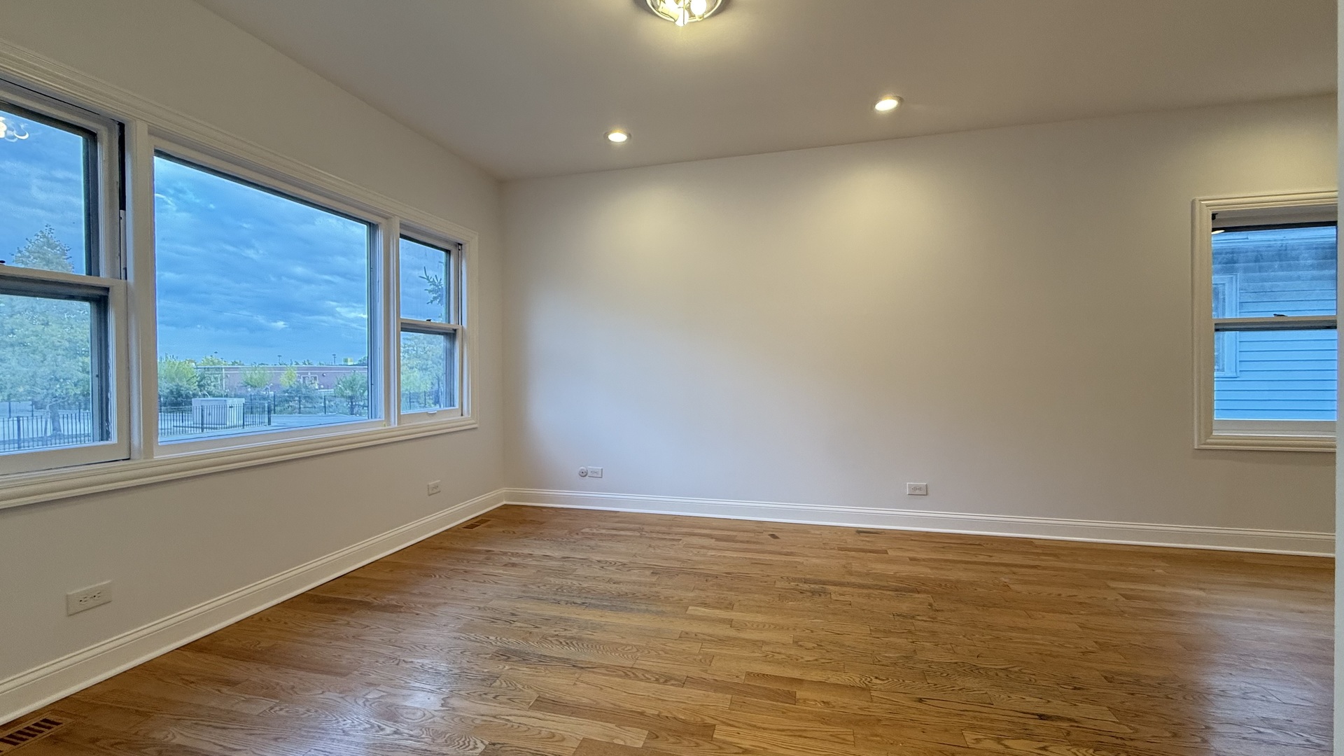 2216 North Central Avenue, Unit 1 Chicago, IL 60639 - Photo 2 of 28 a view of room with window and hardwood floor
