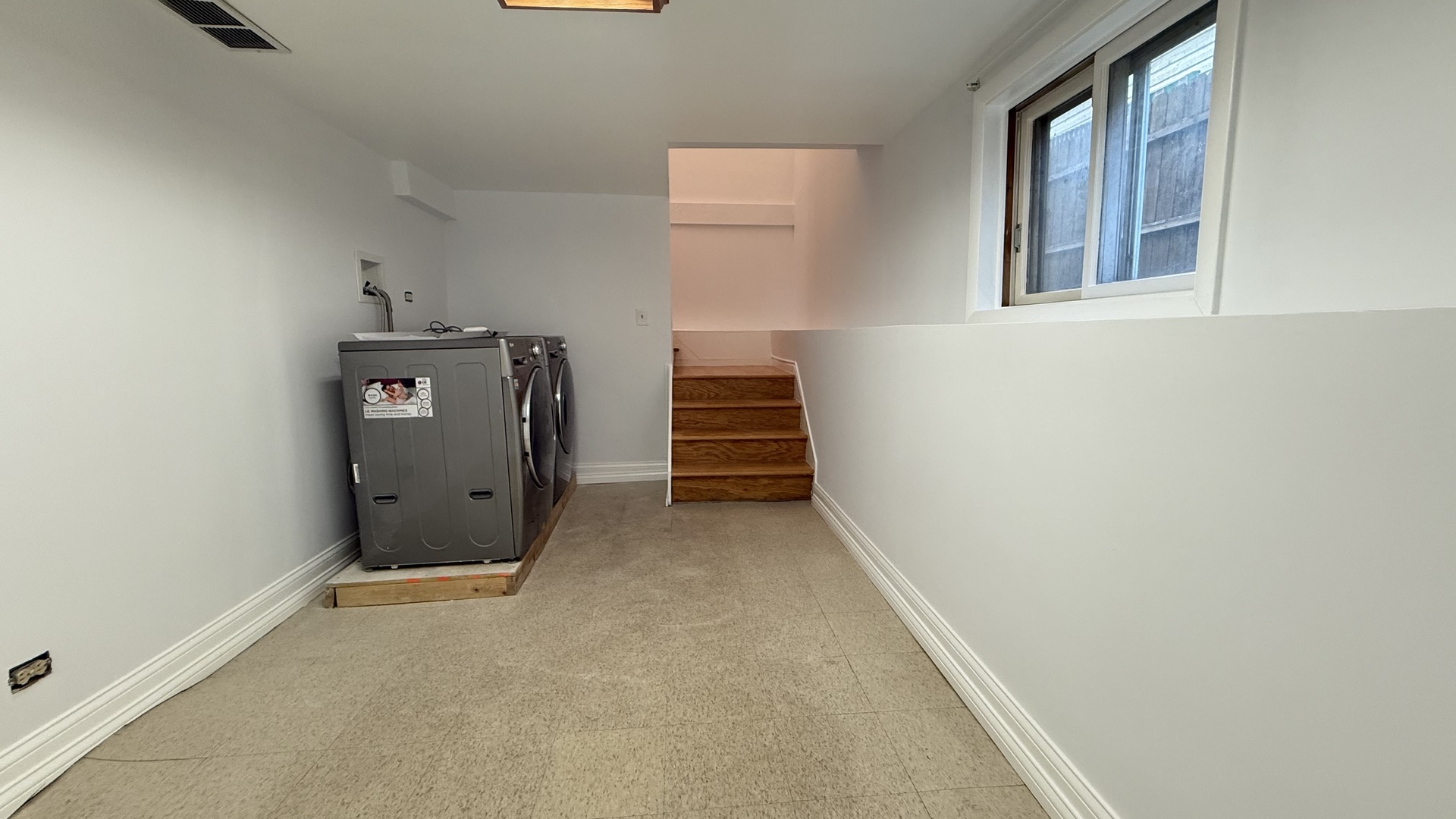 2216 North Central Avenue, Unit 1 Chicago, IL 60639 - Photo 27 of 28 a view of an empty room with wooden floor and stairs