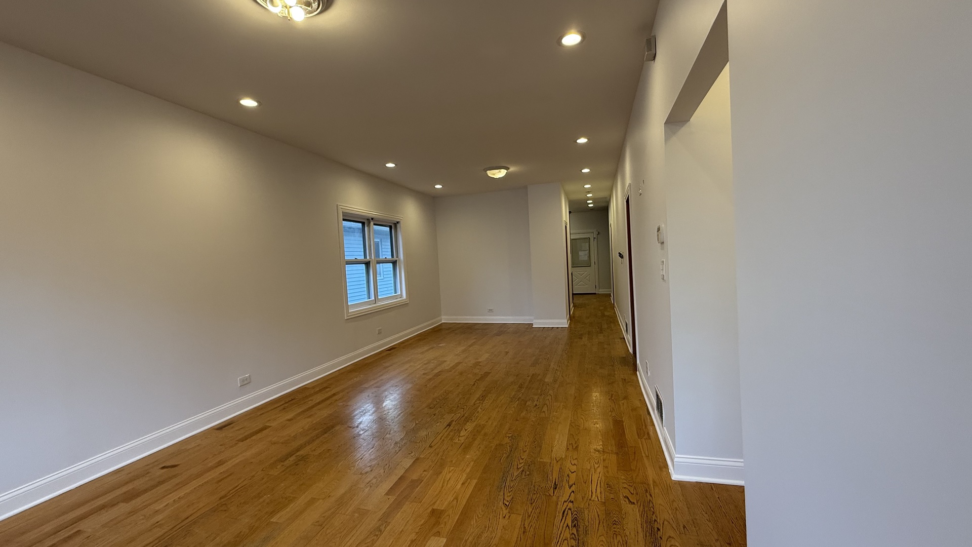 2216 North Central Avenue, Unit 1 Chicago, IL 60639 - Photo 3 of 28 a view of a hallway with wooden floor