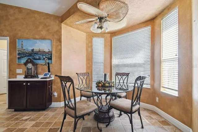 a view of a dining room with furniture window and outside view