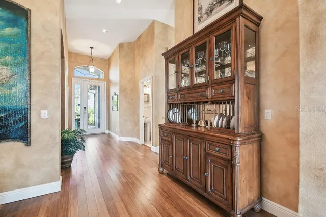 a kitchen with stainless steel appliances granite countertop a stove and a wooden floors