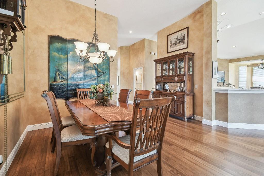 3402 Stonebridge Trail Valrico, FL 33596 - Photo 7 of 17 a view of a dining room with furniture and wooden floor