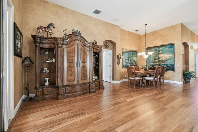 a view of a livingroom with furniture window and wooden floor