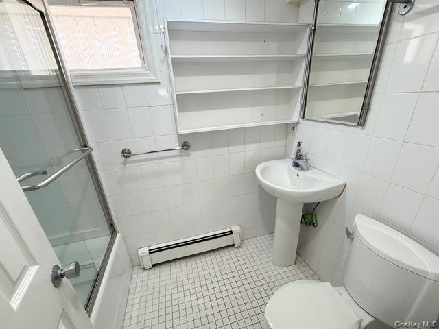 48-22 195th Street Queens, NY 11365 - Photo 14 of 23 a bathroom with a sink toilet and shower