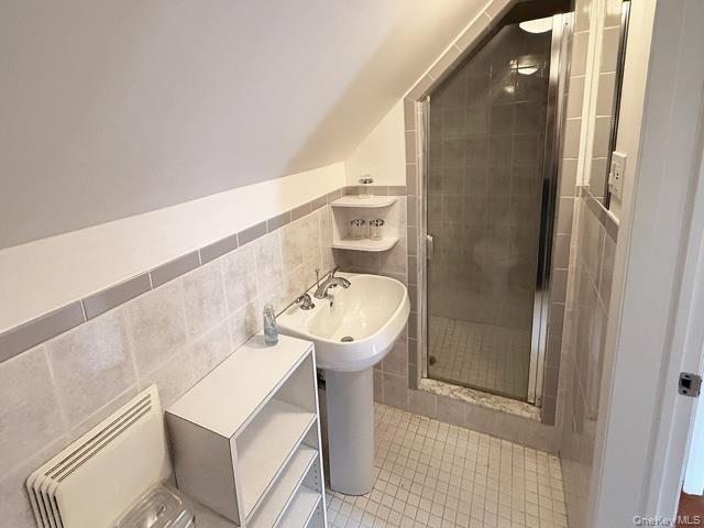 48-22 195th Street Queens, NY 11365 - Photo 15 of 23 a bathroom with a sink toilet and shower