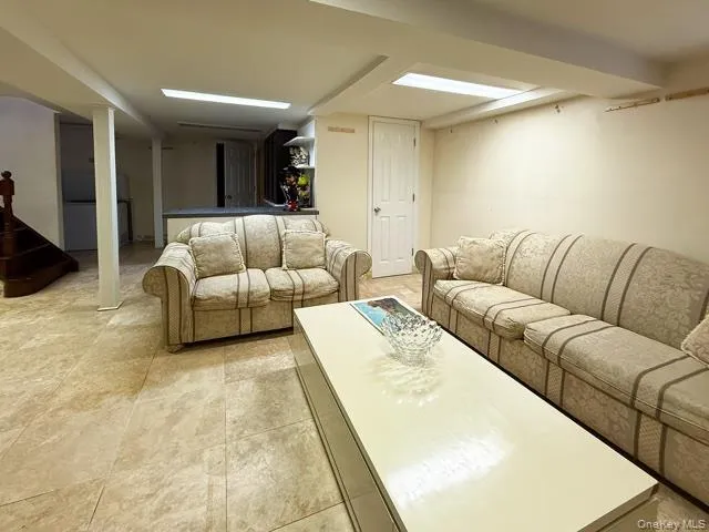 a living room with furniture and white walls