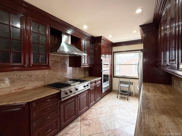 48-22 195th Street Queens, NY 11365 - Photo 6 of 23 a kitchen with granite countertop a stove and a sink